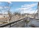 View from balcony overlooking a street with a tree at 13640 E Iliff Pl, Aurora, CO 80014