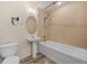Cozy bathroom with a tub, shower, sink, mirror, and toilet at 13640 E Iliff Pl, Aurora, CO 80014