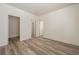 Bright bedroom features neutral walls and modern wood-look flooring throughout the space at 13640 E Iliff Pl, Aurora, CO 80014