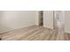 Bedroom with light wood floors and closet at 13640 E Iliff Pl, Aurora, CO 80014
