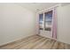 Neutral bedroom with light wood floors and window with privacy blinds at 13640 E Iliff Pl, Aurora, CO 80014