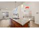 Kitchen with granite countertops, wood cabinets, and stainless steel dishwasher at 13640 E Iliff Pl, Aurora, CO 80014