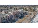 Aerial view of townhomes with a view of the city skyline at 13640 E Iliff Pl, Aurora, CO 80014