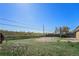 Backyard featuring healthy green grass, secure fencing, and a peaceful surrounding at 11674 Claude Ct, Northglenn, CO 80233