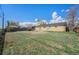 Backyard showing a well-maintained lawn and a brick home exterior, perfect for outdoor activities at 11674 Claude Ct, Northglenn, CO 80233