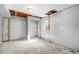 Unfinished basement with concrete floors, wrapped walls, window, and gray accent column at 11674 Claude Ct, Northglenn, CO 80233