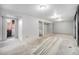 Unfinished basement with multiple rooms and concrete flooring at 11674 Claude Ct, Northglenn, CO 80233