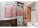Bathroom renovation featuring a marble vanity and pink insulation ready for the next phase of remodeling at 11674 Claude Ct, Northglenn, CO 80233