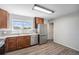 Modern kitchen featuring granite countertops, stainless steel appliances, and wood cabinets at 11674 Claude Ct, Northglenn, CO 80233