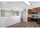 Open view from kitchen featuring stainless appliances and sightlines to the living area at 11674 Claude Ct, Northglenn, CO 80233