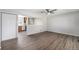 Open-concept living space showcasing modern flooring and seamless flow into kitchen at 11674 Claude Ct, Northglenn, CO 80233