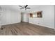 Open-concept living space showcasing modern flooring and seamless flow into kitchen at 11674 Claude Ct, Northglenn, CO 80233
