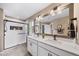 Bright bathroom featuring double sinks, modern fixtures, and a walk-in shower at 15946 Little Bluestem Rd, Monument, CO 80132