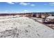 Aerial view of the neighborhood with snow-covered ground and clear blue sky at 1180 Crenshaw St, Castle Rock, CO 80104