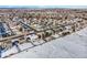 An aerial shot capturing the home surrounded by snowy homes and picturesque views at 1180 Crenshaw St, Castle Rock, CO 80104