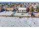 Backyard view features a shed and a deck in the snowy landscape at 1180 Crenshaw St, Castle Rock, CO 80104