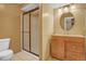 Cozy bathroom with a round mirror, and enclosed shower at 1180 Crenshaw St, Castle Rock, CO 80104