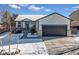 Charming single-Gathering home with a well-kept lawn, gray trim and a spacious two-car garage at 1180 Crenshaw St, Castle Rock, CO 80104