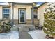 The front porch features brickwork accents and ample space for welcoming guests to this charming home at 1180 Crenshaw St, Castle Rock, CO 80104