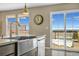 Bright kitchen area with a modern sink, stainless steel appliances, and scenic outdoor views at 1180 Crenshaw St, Castle Rock, CO 80104