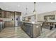 Spacious kitchen featuring stainless steel appliances, a large island, and wooden cabinetry at 1180 Crenshaw St, Castle Rock, CO 80104