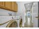 Practical laundry area featuring a washer and dryer with storage cabinets above at 1180 Crenshaw St, Castle Rock, CO 80104