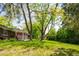 Expansive backyard with mature trees, offering shade and privacy, perfect for outdoor activities at 1757 S Van Dyke Way, Lakewood, CO 80228