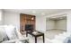 Finished basement with brick fireplace and comfortable seating area at 1757 S Van Dyke Way, Lakewood, CO 80228