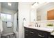 Updated bathroom with modern vanity, updated fixtures, and tiled shower at 1757 S Van Dyke Way, Lakewood, CO 80228