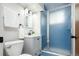 Updated bathroom with frosted glass shower, gray vanity, and modern lighting at 1757 S Van Dyke Way, Lakewood, CO 80228