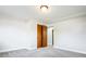 Bedroom featuring closet with wooden doors, carpet, and neutral paint at 1757 S Van Dyke Way, Lakewood, CO 80228