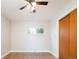 Well-lit bedroom with hardwood floors, ceiling fan, and large window at 1757 S Van Dyke Way, Lakewood, CO 80228