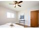 Comfortable bedroom featuring hardwood floors, ceiling fan, and modern decor at 1757 S Van Dyke Way, Lakewood, CO 80228