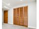 Bedroom featuring wooden doors and neutral paint at 1757 S Van Dyke Way, Lakewood, CO 80228
