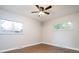 Spacious bedroom with hardwood floors, ample natural light, and ceiling fan at 1757 S Van Dyke Way, Lakewood, CO 80228