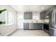 Bright kitchen featuring stainless steel appliances, and gray cabinets at 1757 S Van Dyke Way, Lakewood, CO 80228