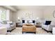 Inviting living room with neutral tones, stylish furniture, and a comfortable seating arrangement at 1757 S Van Dyke Way, Lakewood, CO 80228