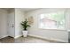 Bright living room with large window, wood floors, and neutral decor at 1757 S Van Dyke Way, Lakewood, CO 80228