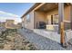 The home's outdoor space offers a patio with a hot tub, a grill, and a well-maintained yard, perfect for outdoor living at 222 Fox St, Bennett, CO 80102