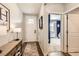 Bright foyer with hardwood floors, offering a warm welcome with a glimpse into the living spaces at 222 Fox St, Bennett, CO 80102