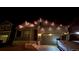 Charming single Gathering home featuring lights on eves, inviting curb appeal at 222 Fox St, Bennett, CO 80102