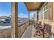 Relaxing front porch with seating, offering a comfortable outdoor space to enjoy the neighborhood at 222 Fox St, Bennett, CO 80102