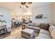 Open-concept living room with a kitchen view, ideal for entertaining and Gathering gatherings at 222 Fox St, Bennett, CO 80102