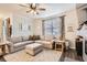 Comfortable living room with a large sectional sofa, providing ample seating for Gathering and guests at 222 Fox St, Bennett, CO 80102
