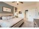 Spacious bedroom features soft carpet, a window, and an ensuite bathroom at 222 Fox St, Bennett, CO 80102