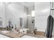 Bathroom with double sink vanity, a walk-in shower, and neutral-toned decor at 3103 W 18Th Ave, Denver, CO 80204