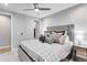 Bedroom with soft light, large bed with decorative pillows, and a nightstand with a lamp at 3103 W 18Th Ave, Denver, CO 80204