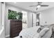 Bedroom featuring a tv, dresser and ensuite bath at 3103 W 18Th Ave, Denver, CO 80204