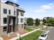Contemporary townhome features a clean-lined facade and landscaped yard, creating curb appeal at 3103 W 18Th Ave, Denver, CO 80204