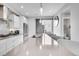 Bright kitchen featuring a large island with pendant lighting and stainless steel appliances at 3103 W 18Th Ave, Denver, CO 80204